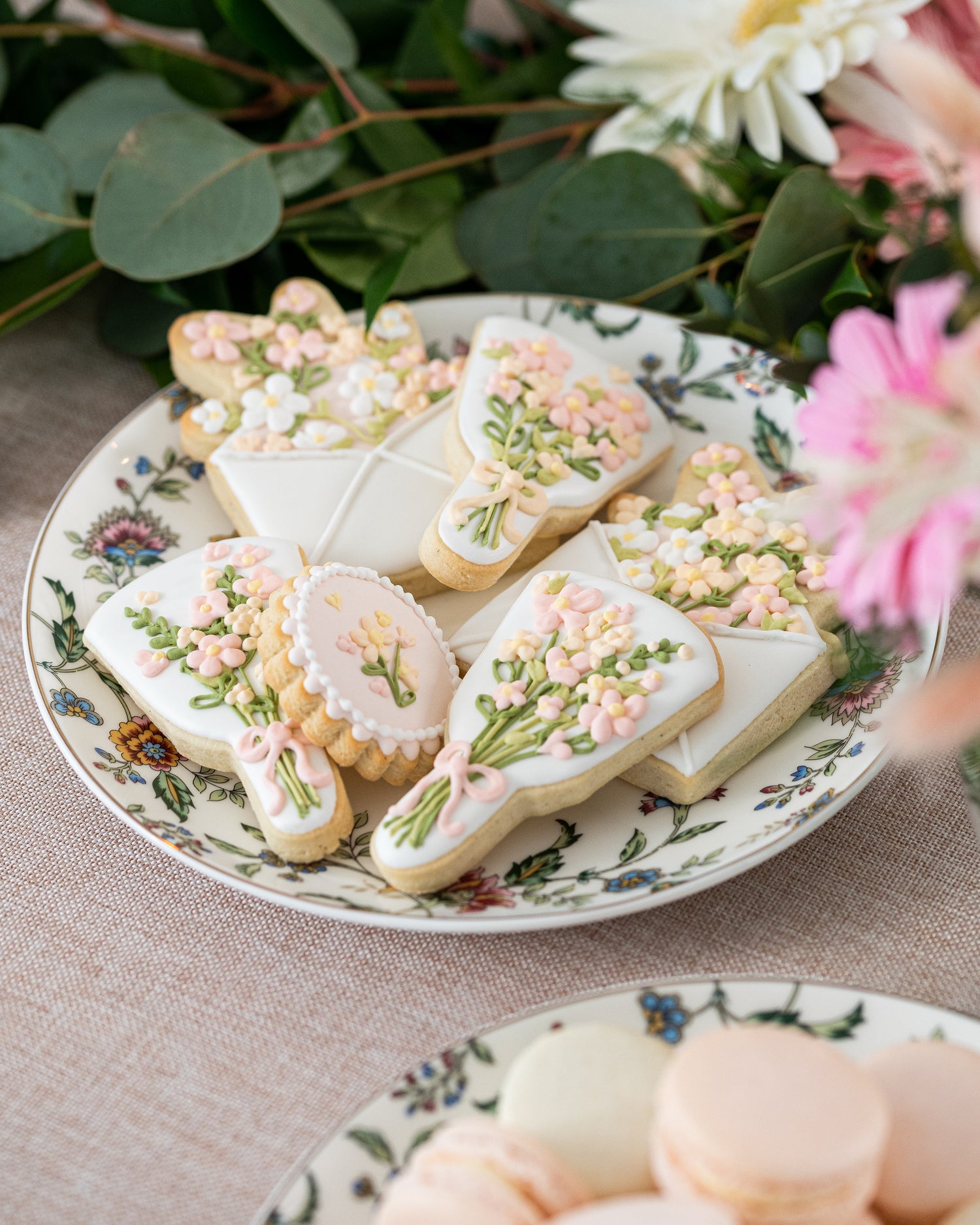 royal icing decorated sugar cookies for dessert table with peach and pink flowers