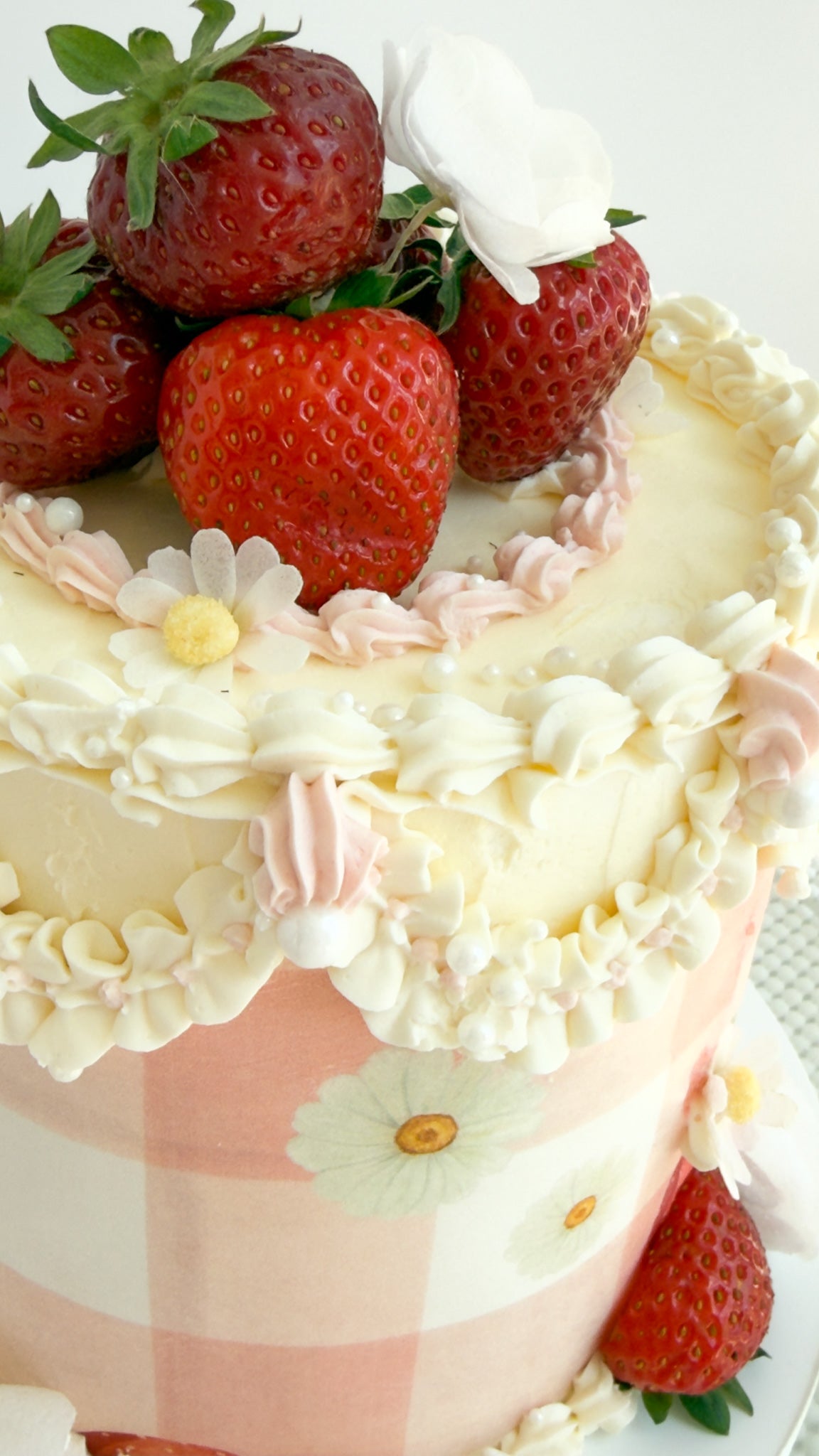 Vintage gingham cake with fresh strawberries