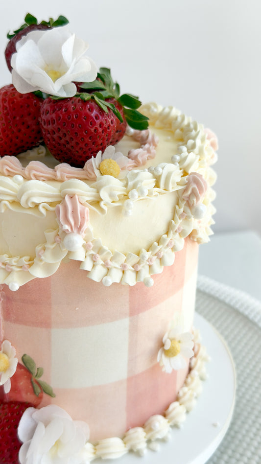 Vintage gingham cake with fresh strawberries